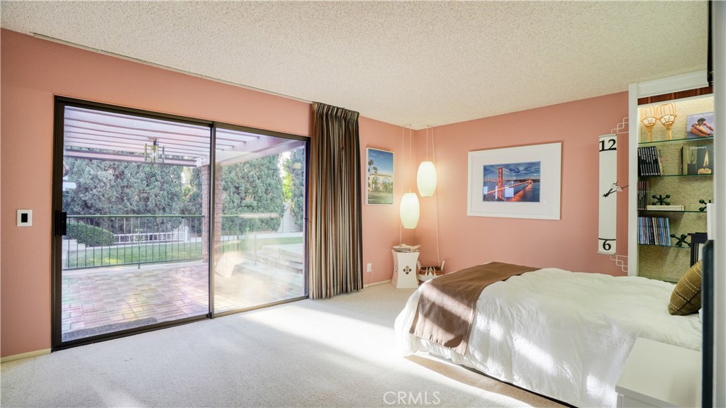 2117 Capuchin Way Claremont, CA 91711 - Photo 19 of 36 a bedroom with a bed and a large window
