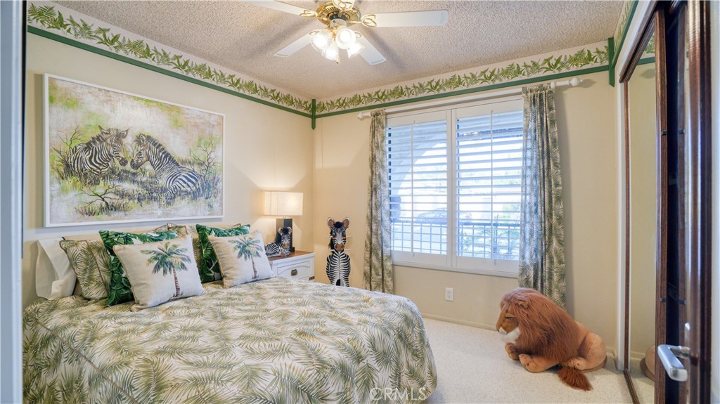 2117 Capuchin Way Claremont, CA 91711 - Photo 23 of 36 a bedroom with a bed and a painting on the wall