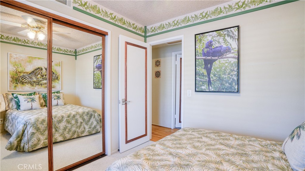 2117 Capuchin Way Claremont, CA 91711 - Photo 24 of 36 a bedroom with a bed and a painting on the wall