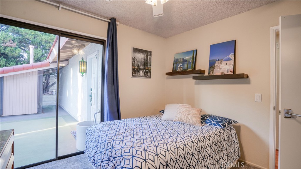 2117 Capuchin Way Claremont, CA 91711 - Photo 26 of 36 a bedroom with a bed and wooden floor