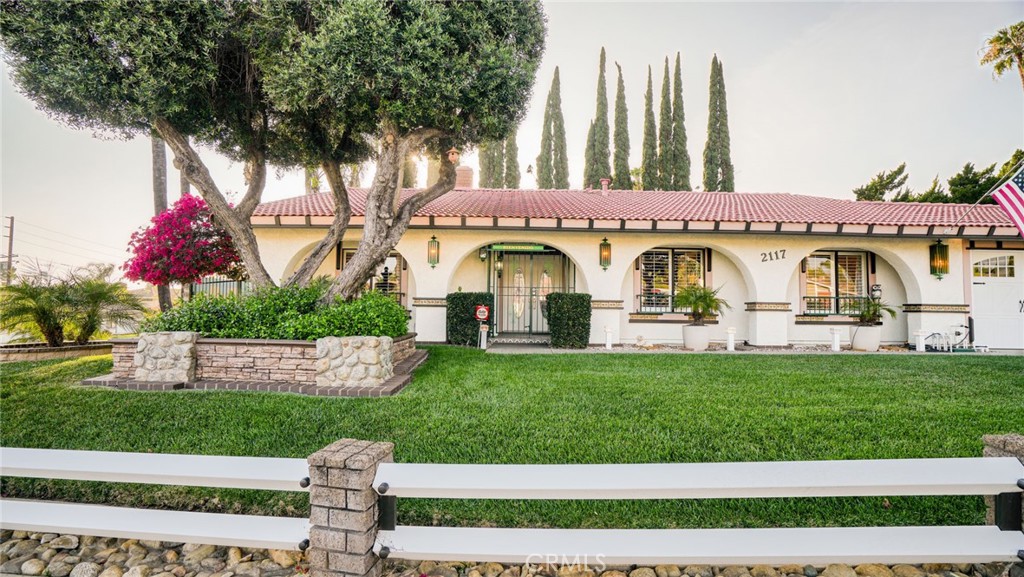 2117 Capuchin Way Claremont, CA 91711 - Photo 3 of 36 a view of white house with a yard and table and chairs