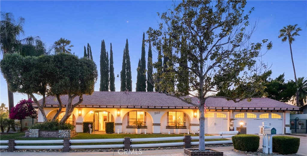 2117 Capuchin Way Claremont, CA 91711 - Photo 34 of 36 a view of a patio with table and chairs under an umbrella