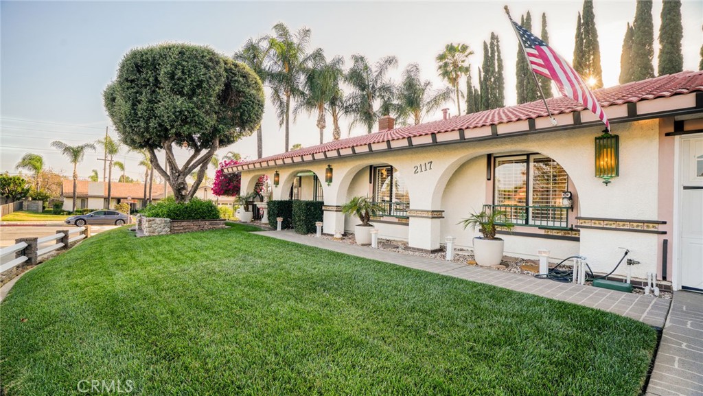 2117 Capuchin Way Claremont, CA 91711 - Photo 4 of 36 a view of a swimming pool with a bench and trees in the background