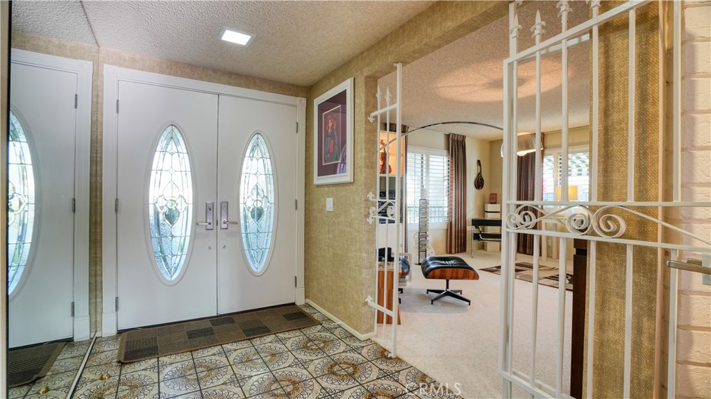 2117 Capuchin Way Claremont, CA 91711 - Photo 6 of 36 a view of a hallway with dining area and glass door