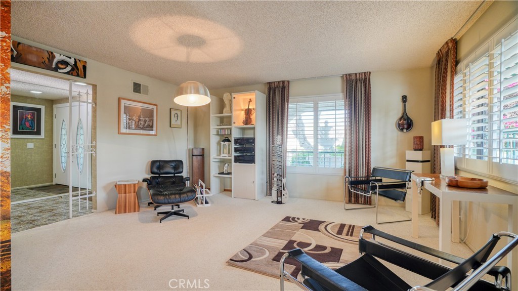 2117 Capuchin Way Claremont, CA 91711 - Photo 8 of 36 a view of a livingroom with furniture and a window