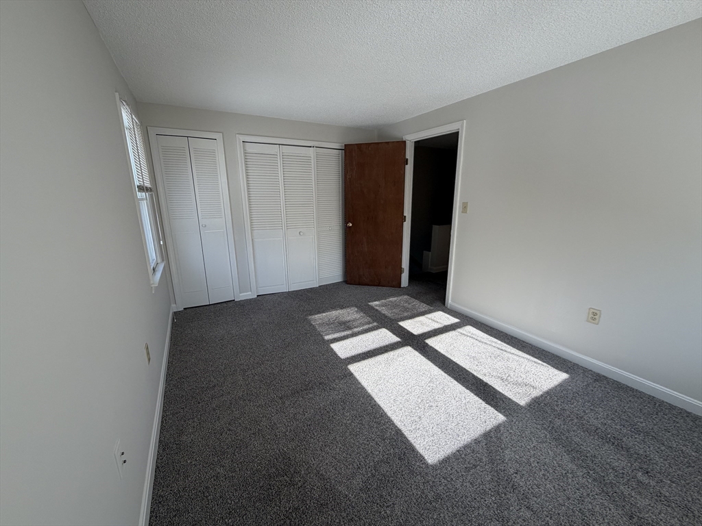 213 Victoria Heights Road, Unit 213 Boston, MA 02136 - Photo 15 of 18 a view of an empty room