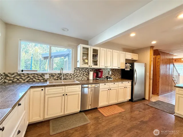 a bathroom with a sink a toilet and tub