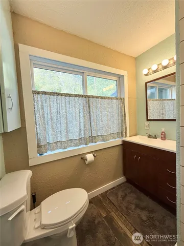 a bathroom with a shower and a sink