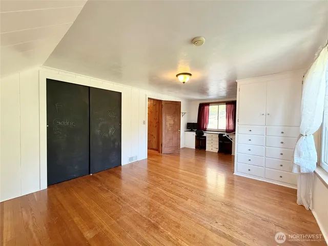 a view of livingroom with furniture wooden floor and window