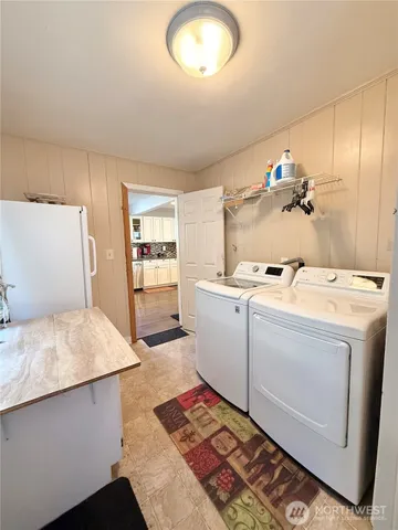 a view of a living room and kitchen
