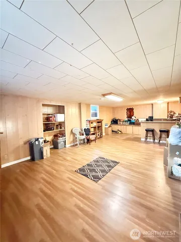 a view of a living room with kitchen