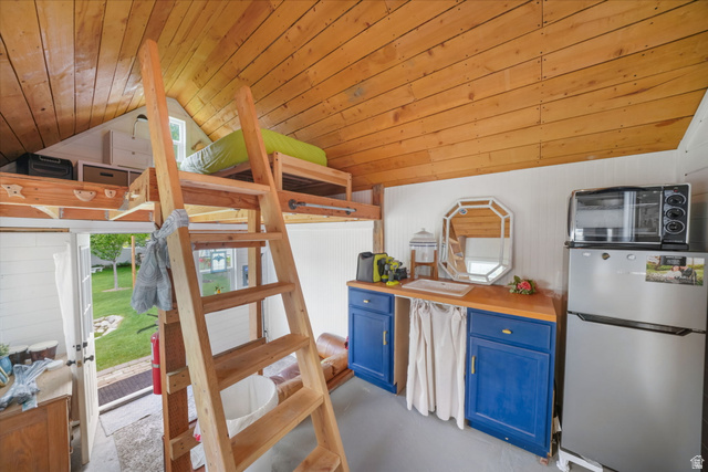 357 South 320 W Street Lindon, UT 84042 - Photo 33 of 41 Wood-paneled ceilings highlight the lofted sleeping area, accessible via a wooden ladder