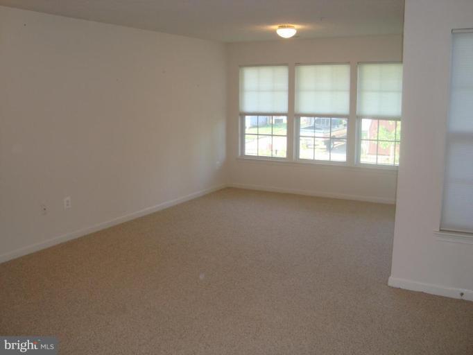 9860 Decatur Road Middle River, MD 21220 - Photo 3 of 7 an empty room with a window