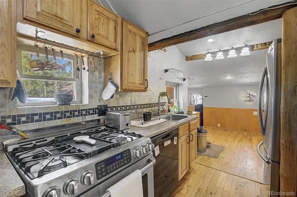 a kitchen with stove and cabinets