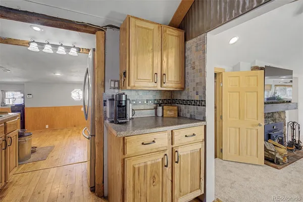 a kitchen with stainless steel appliances a refrigerator and cabinets
