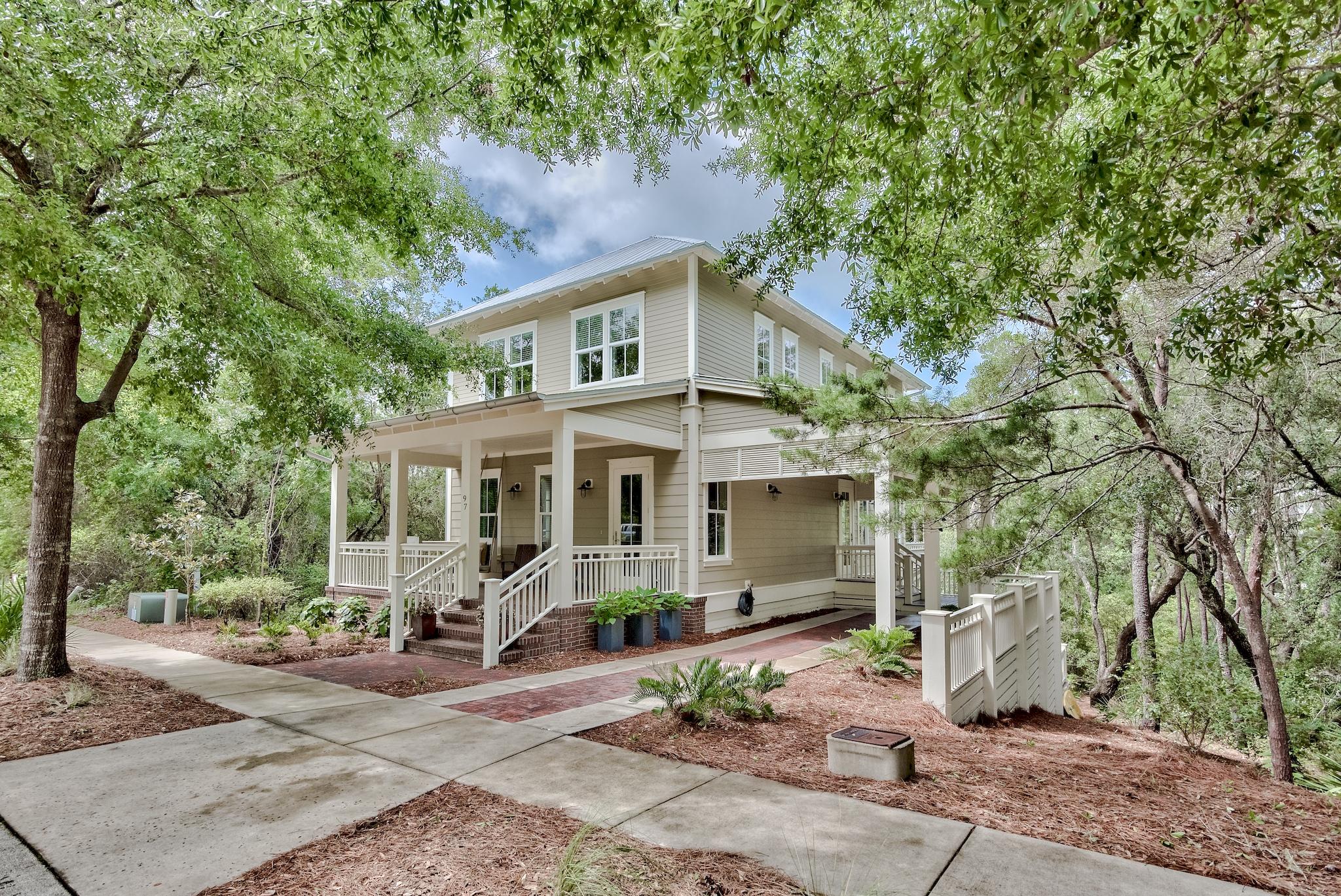 97 Okeechobee West Santa Rosa Beach, FL 32459 - Photo 1 of 46 a front view of a house with garden