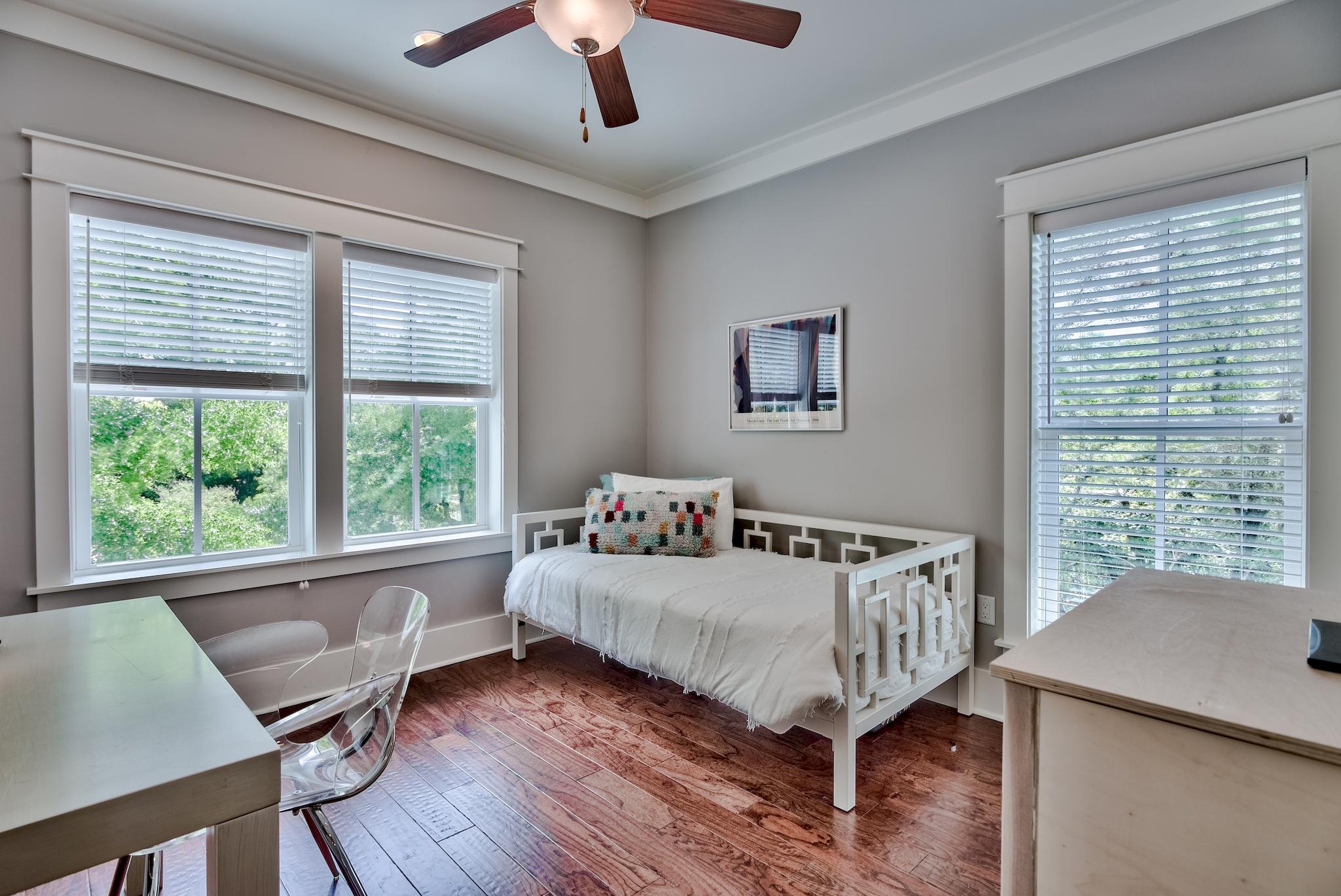 97 Okeechobee West Santa Rosa Beach, FL 32459 - Photo 27 of 46 a bed sitting in a bedroom next to a window
