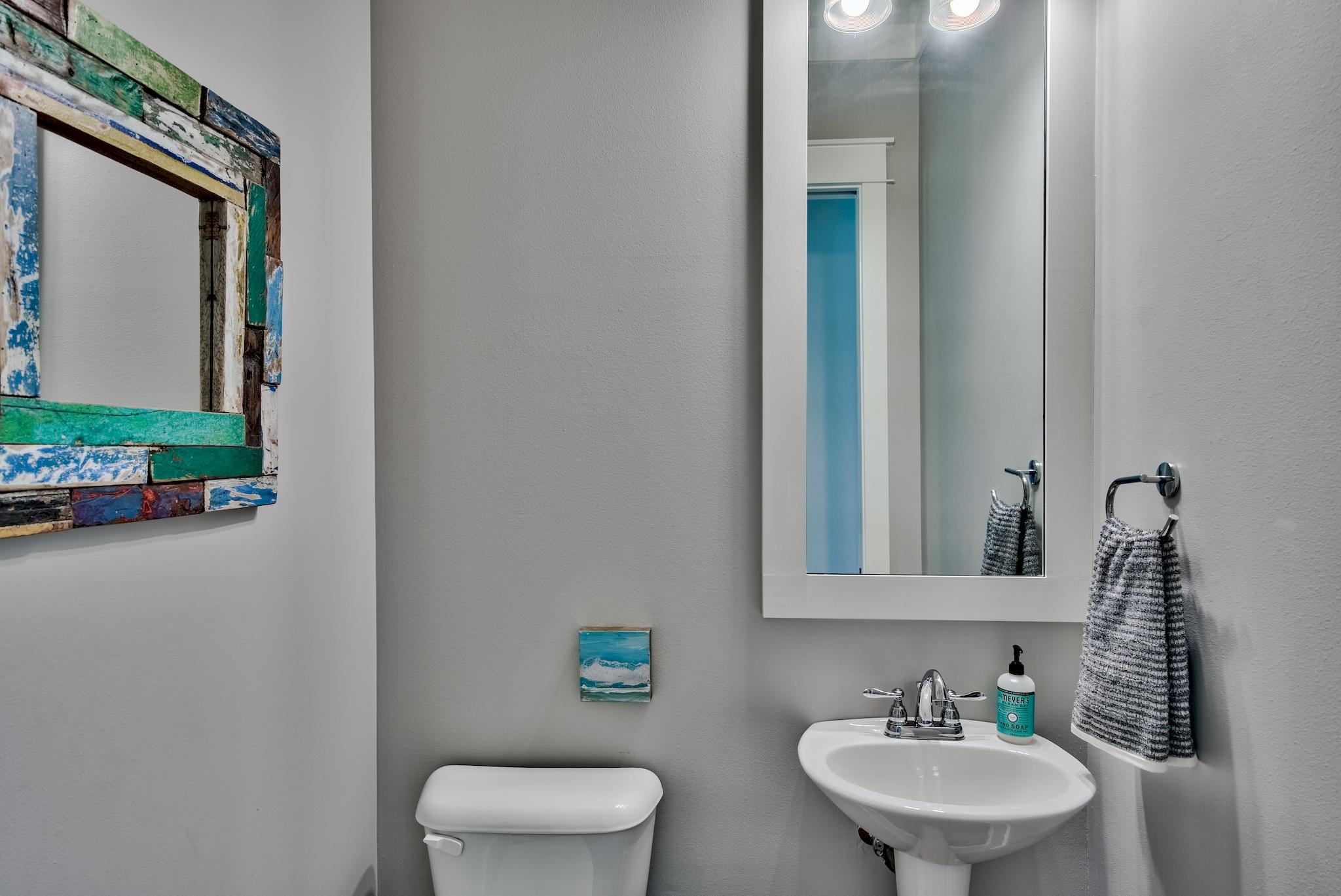 97 Okeechobee West Santa Rosa Beach, FL 32459 - Photo 33 of 46 a bathroom with a toilet sink and mirror