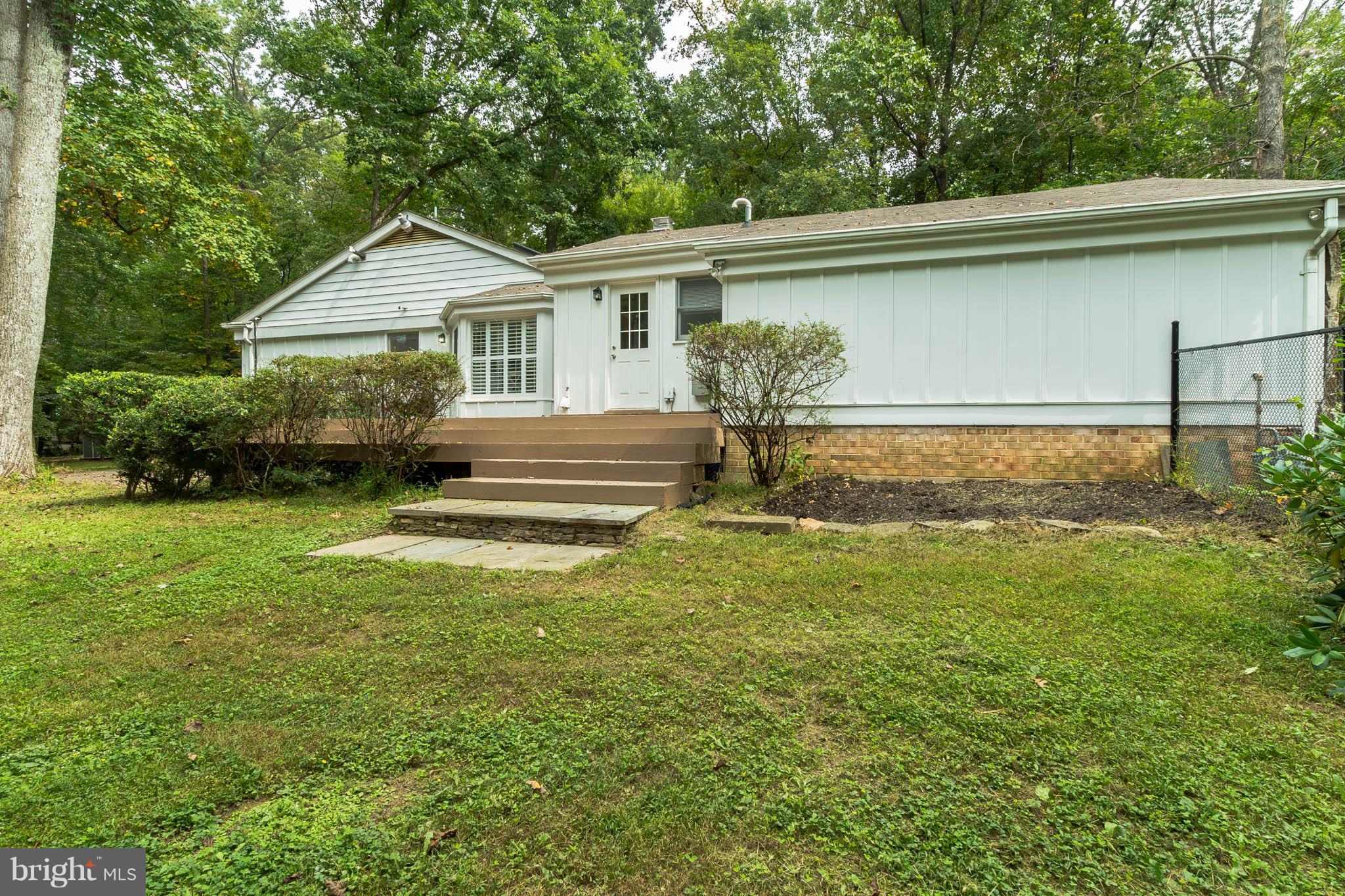 9541 Warfield Road Gaithersburg, MD 20882 - Photo 26 of 29 Side treated wood deck.
