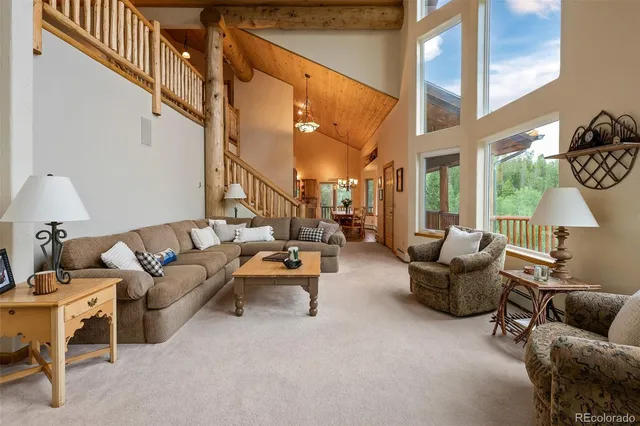 a view of balcony with furniture and umbrella