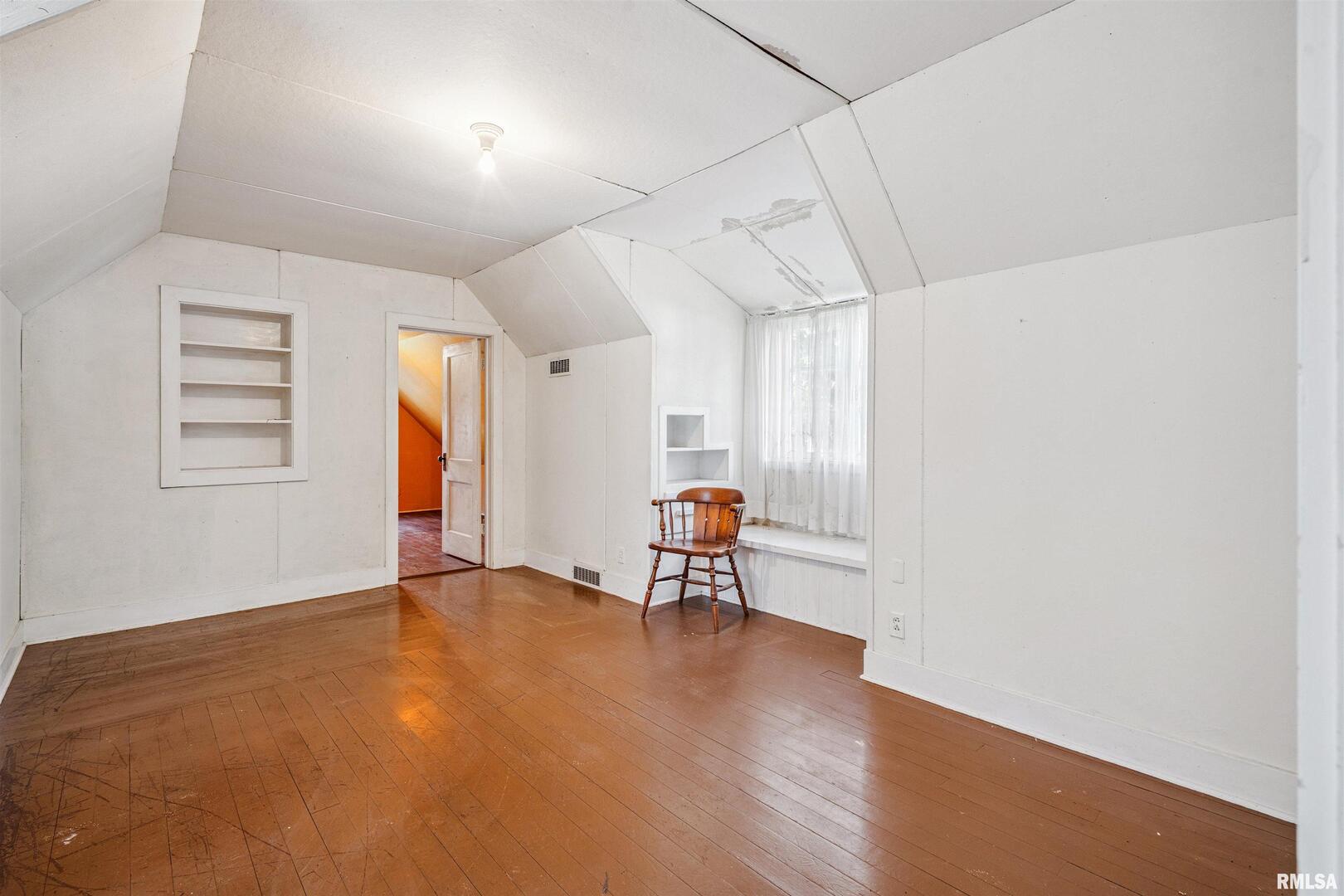 314 West 3rd Street Prophetstown, IL 61277 - Photo 21 of 29 a view of a room with window and wooden floor