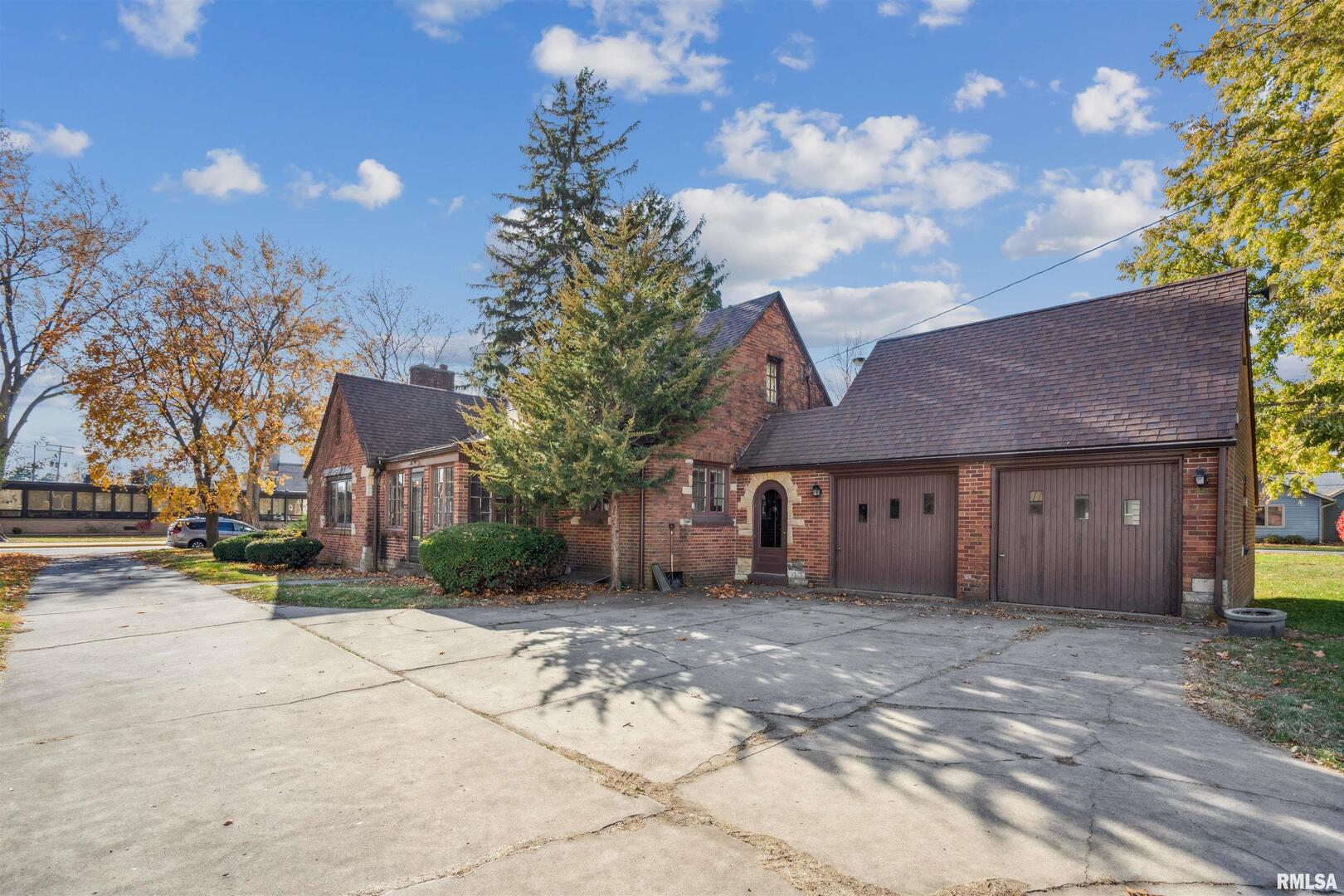 314 West 3rd Street Prophetstown, IL 61277 - Photo 25 of 29 a front view of a house with a yard and garage