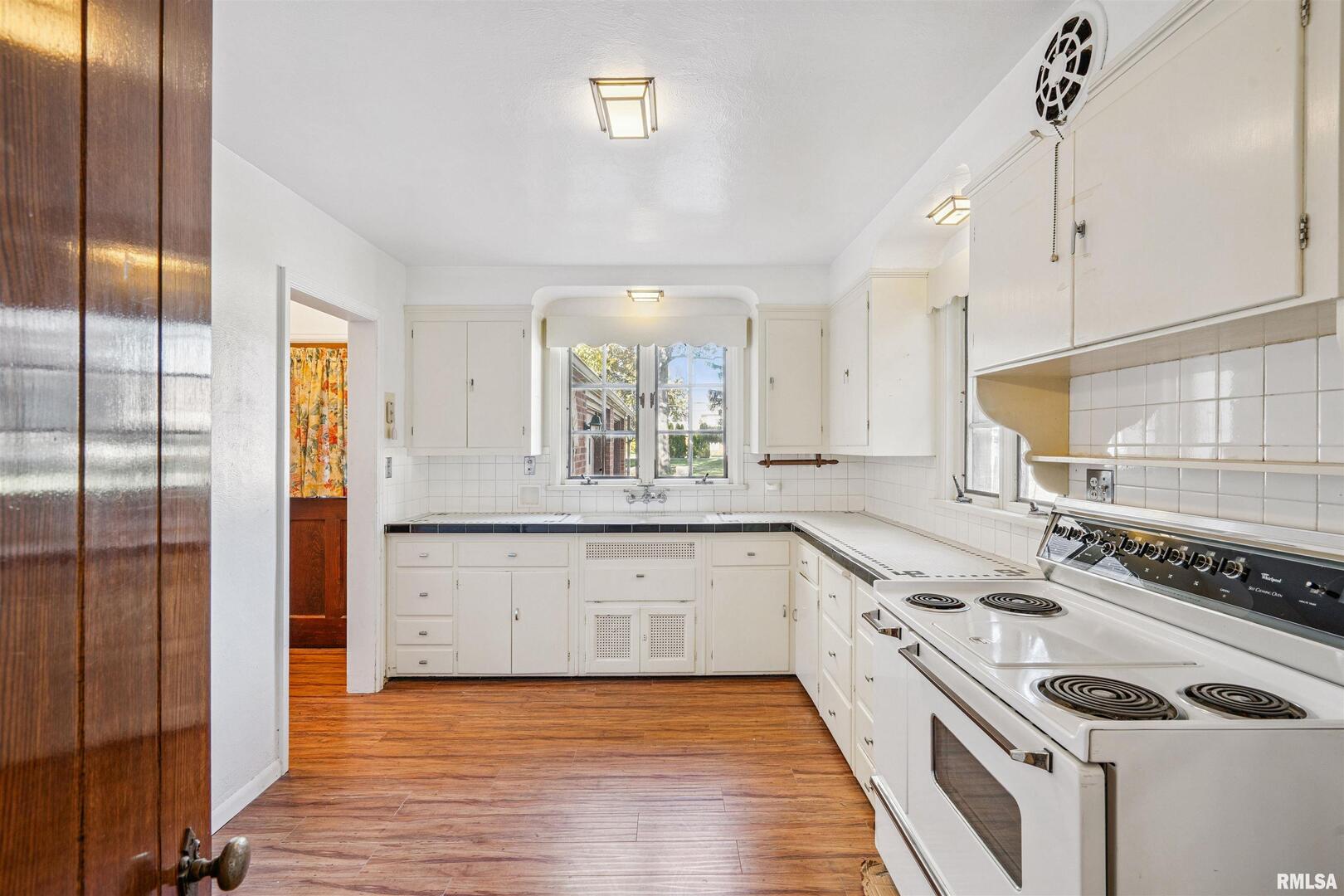 314 West 3rd Street Prophetstown, IL 61277 - Photo 4 of 29 a large kitchen with a stove and a refrigerator