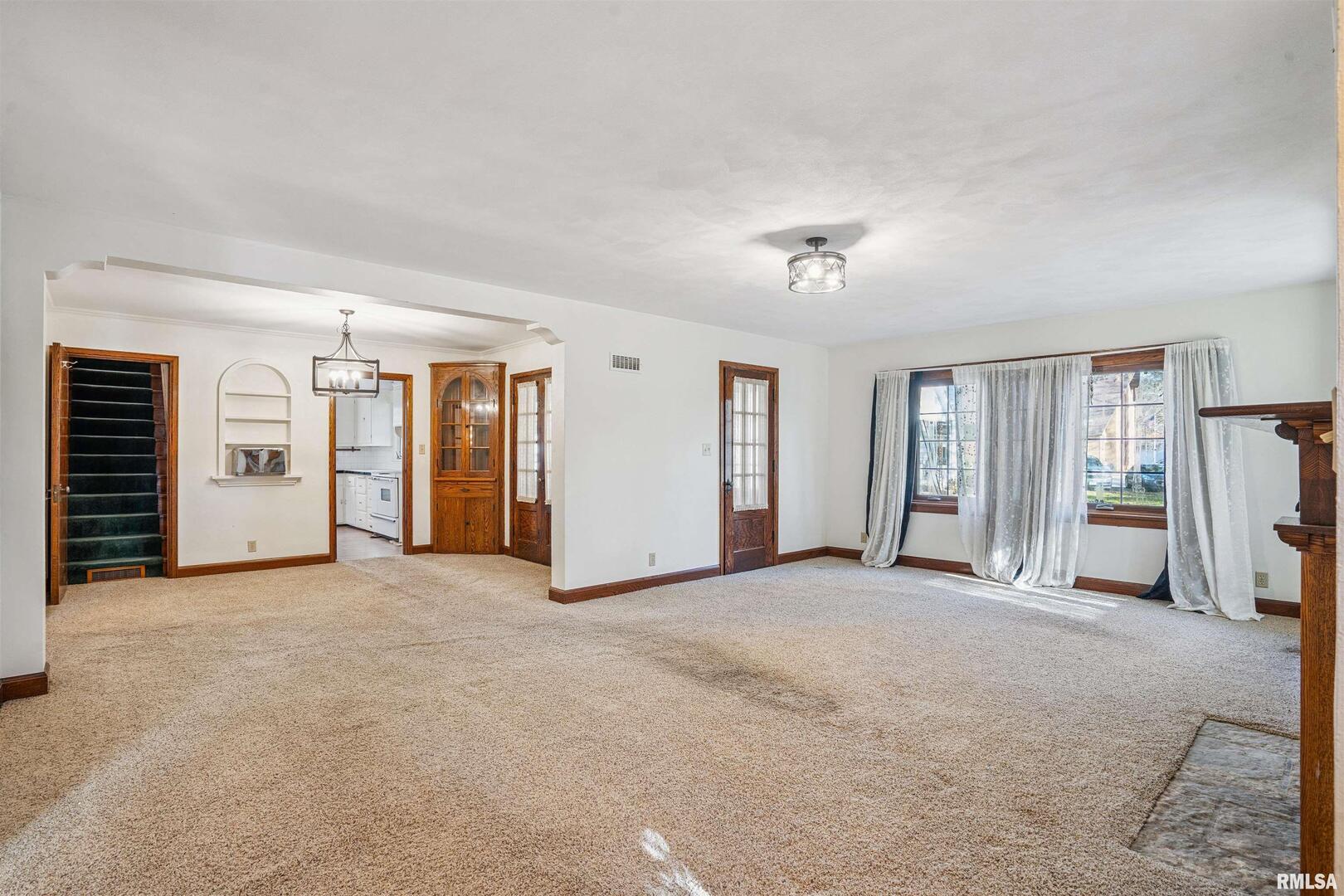 314 West 3rd Street Prophetstown, IL 61277 - Photo 7 of 29 an empty room with closet and windows