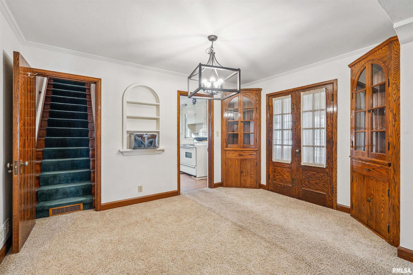 314 West 3rd Street Prophetstown, IL 61277 - Photo 10 of 29 wooden floor in an empty room with a window