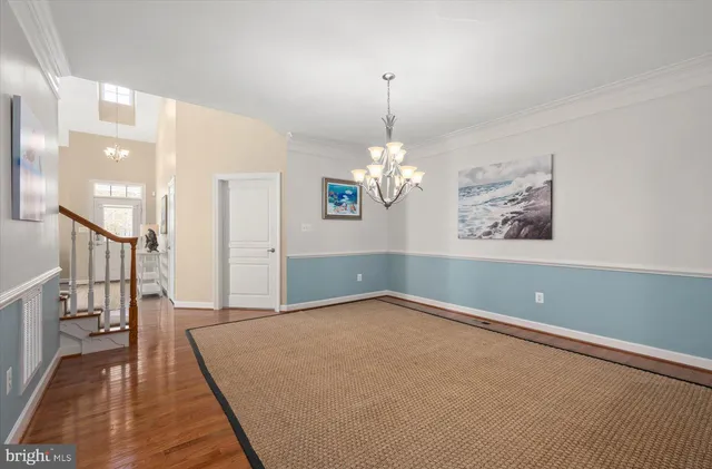 a kitchen with stainless steel appliances granite countertop a sink a stove and a microwave