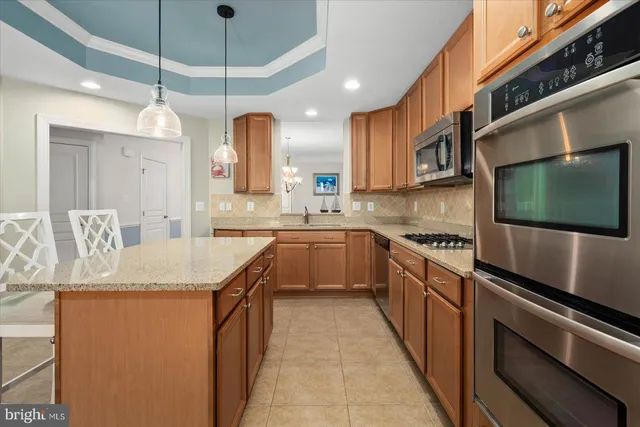 a kitchen with a table and chairs