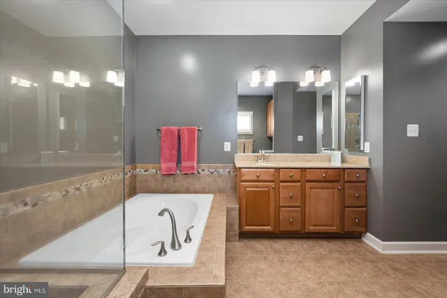 a bathroom with a sink a toilet and shower curtain