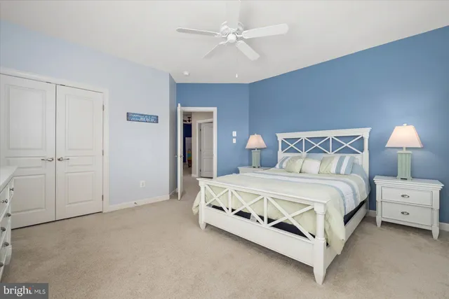 a bedroom with a bed and a flat tv screen in it