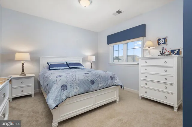 an empty room with closet and mirrors