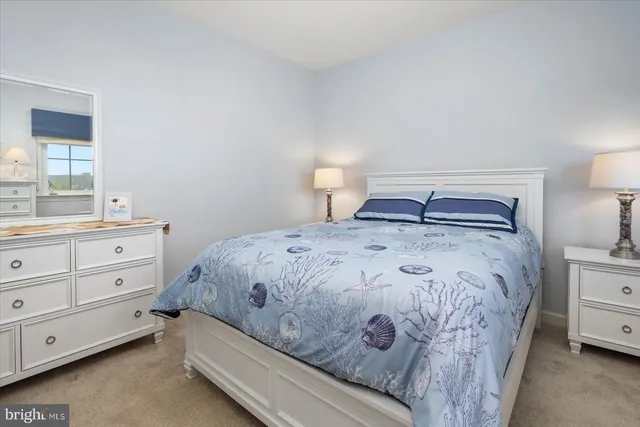 a living room with furniture and a lamp