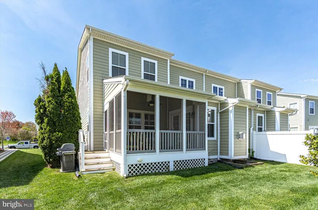 an aerial view of a house a yard swimming pool and outdoor seating