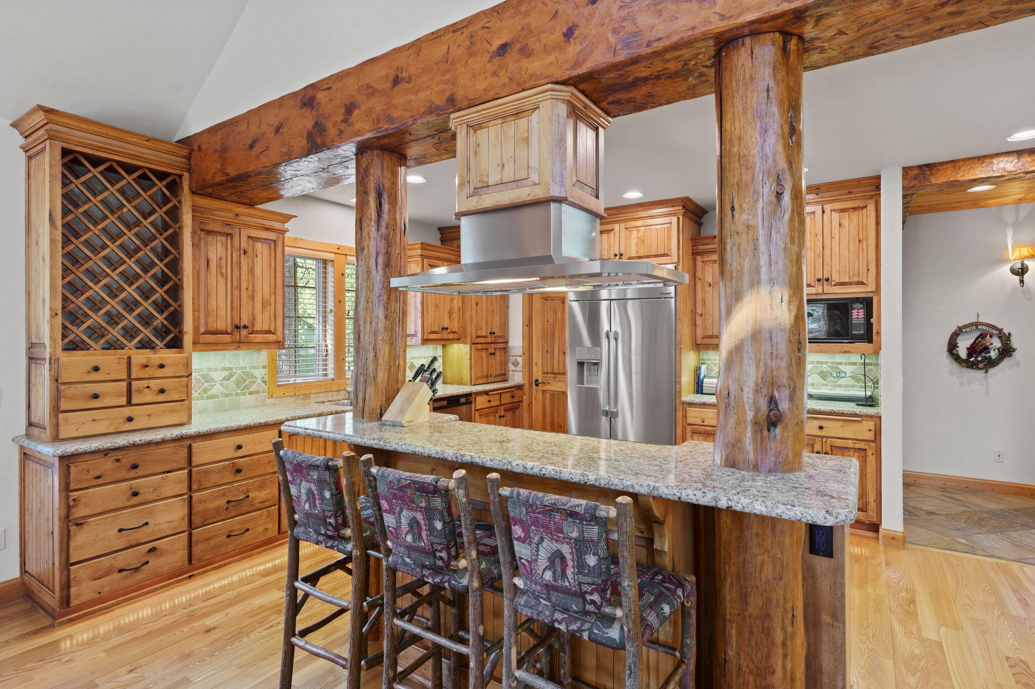 58026 Kinglet Road Sunriver, OR 97707 - Photo 12 of 39 a kitchen with stainless steel appliances granite countertop a stove a sink and a refrigerator
