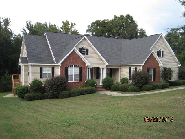6580 Rogers Road Lizella, GA 31052 - Photo 1 of 1 a front view of a house with a yard