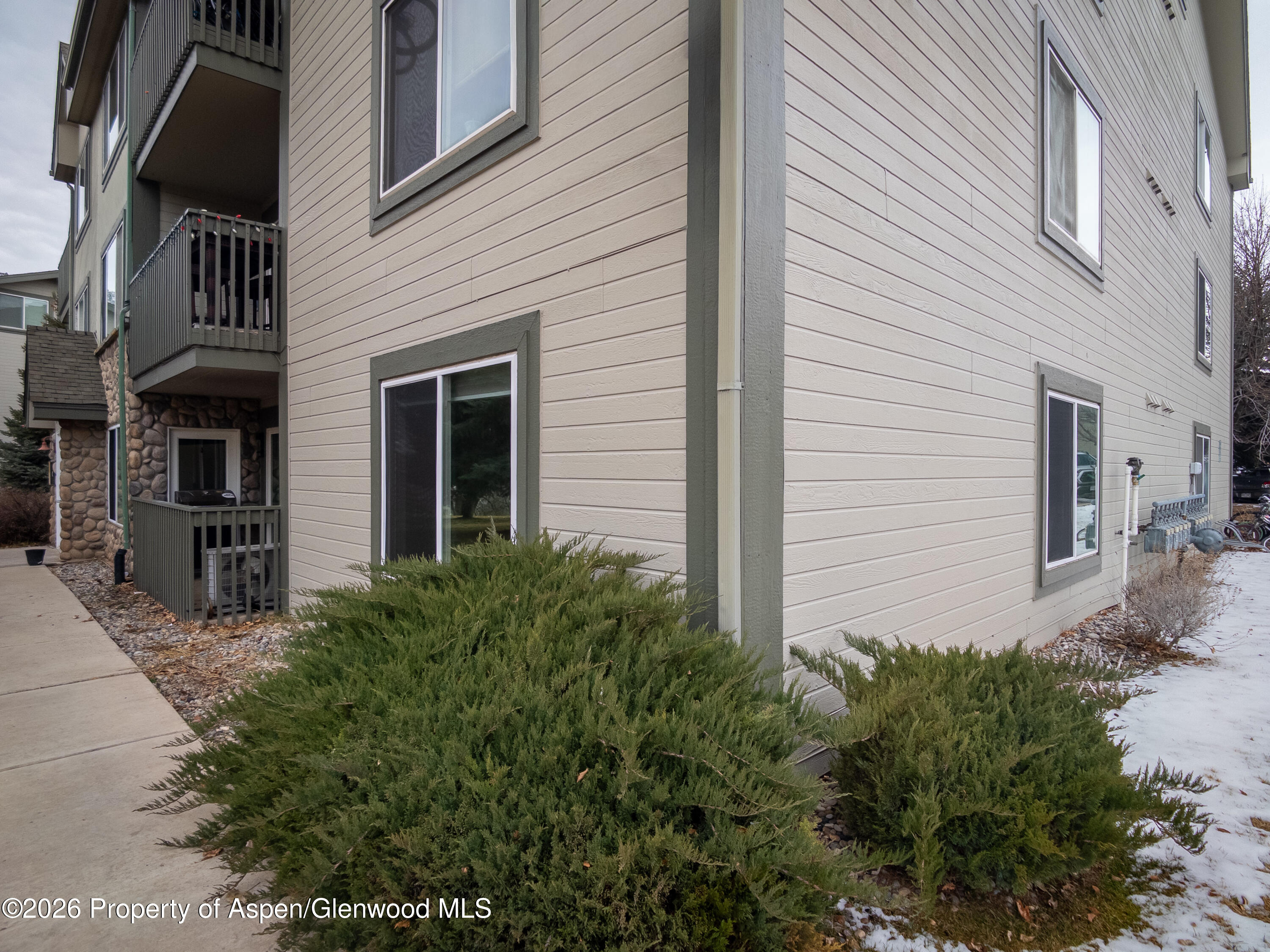 792 Castle Valley Boulevard, Unit B New Castle, CO 81647 - Photo 17 of 25 a view of a house with many windows