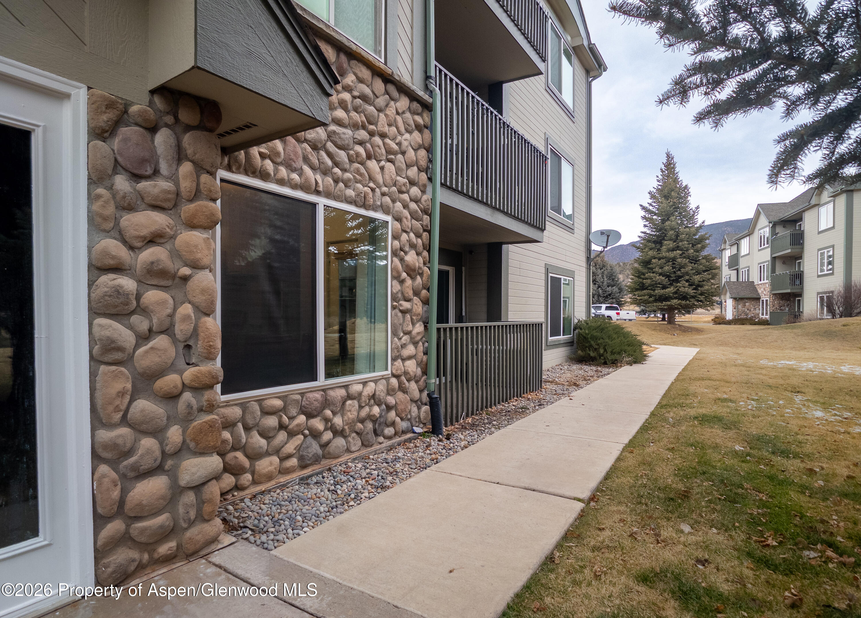 792 Castle Valley Boulevard, Unit B New Castle, CO 81647 - Photo 19 of 25 a front view of a house with a yard