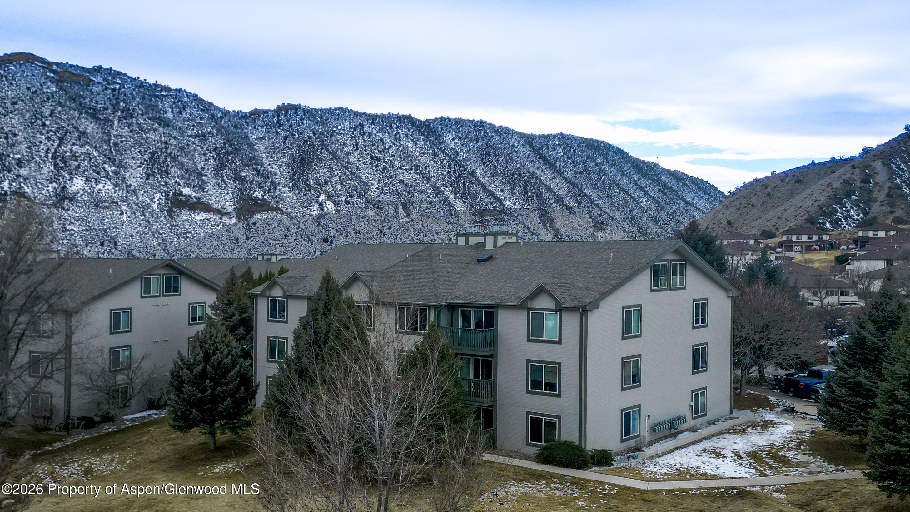 792 Castle Valley Boulevard, Unit B New Castle, CO 81647 - Photo 25 of 25 a view of a white house next to a road