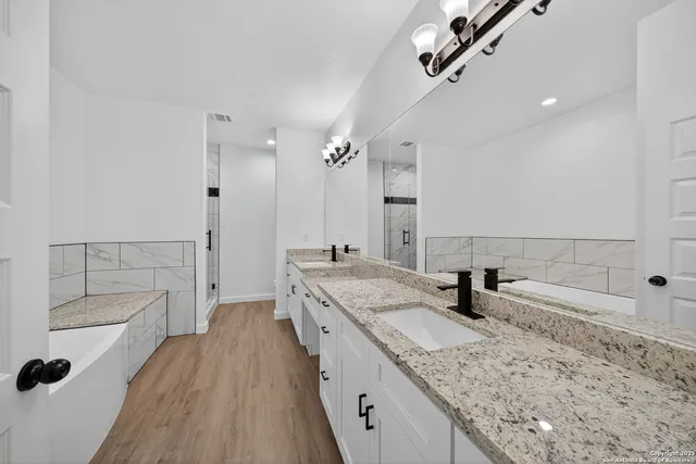 a bathroom with a bathtub and a shower