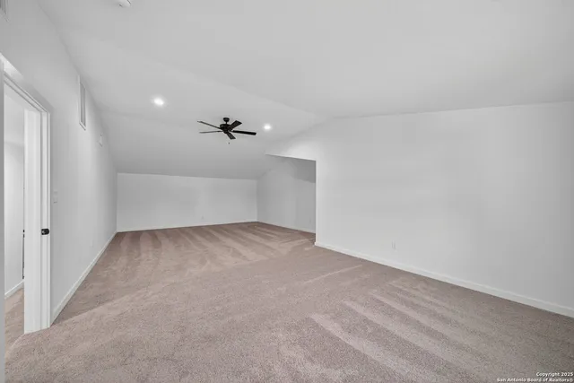 a view of a workspace with furniture and wooden floor