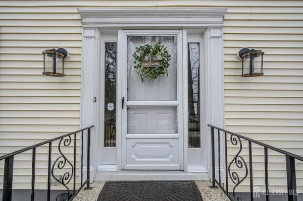 a view of front door and deck of the house