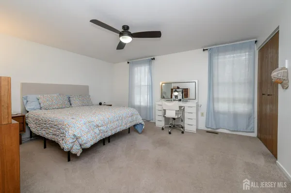a bedroom with a bed and a cabinets