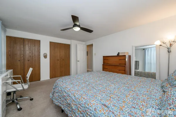 a bedroom with a bed and furniture