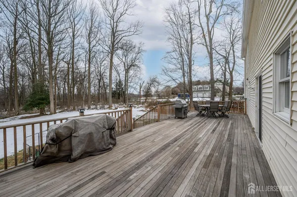 a view of a patio with iron fence