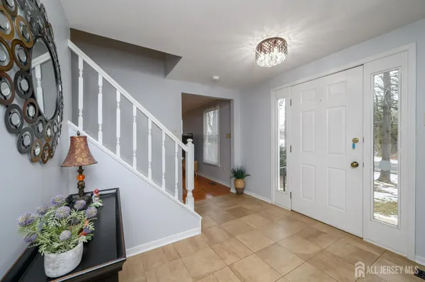 a view of entryway and hall with a window