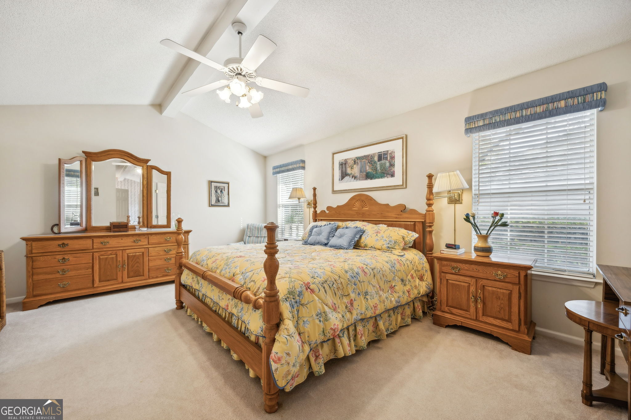 223 Cardinal Circle West St. Marys, GA 31558 - Photo 15 of 54 a bedroom with a bed a chandelier and dresser