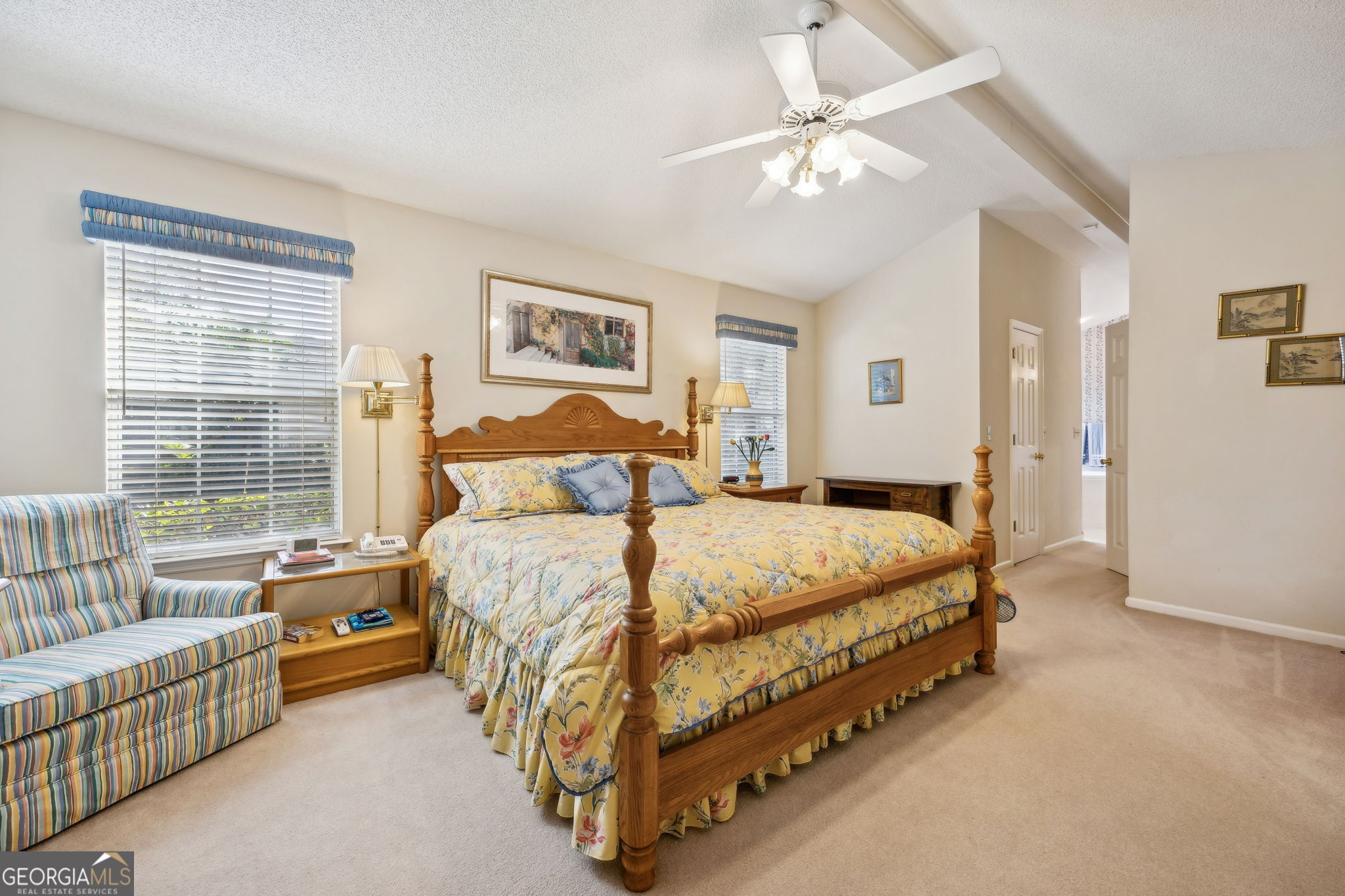 223 Cardinal Circle West St. Marys, GA 31558 - Photo 17 of 54 a bedroom with a bed and a chandelier